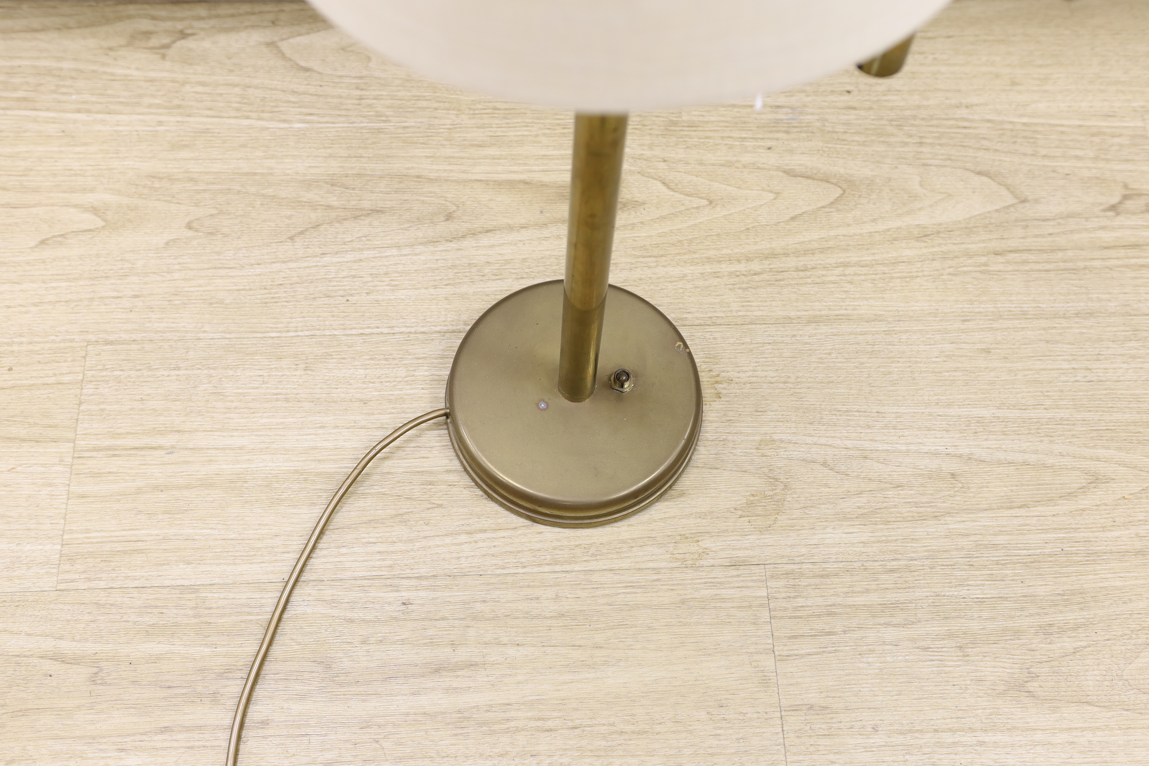 A brass swivel arm table lamp